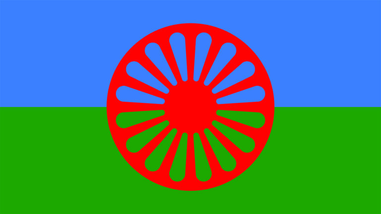 © Romano Svato Ein rotes Rad auf blau-grüner Fahne